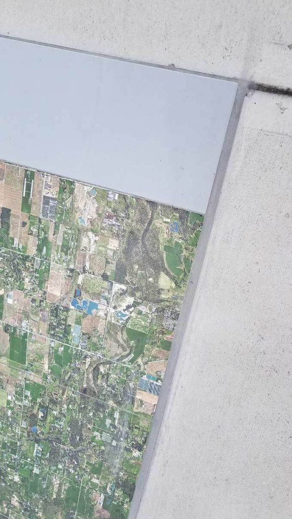 A partial view of a map tiled onto the floor of an observation platform in Vancouver